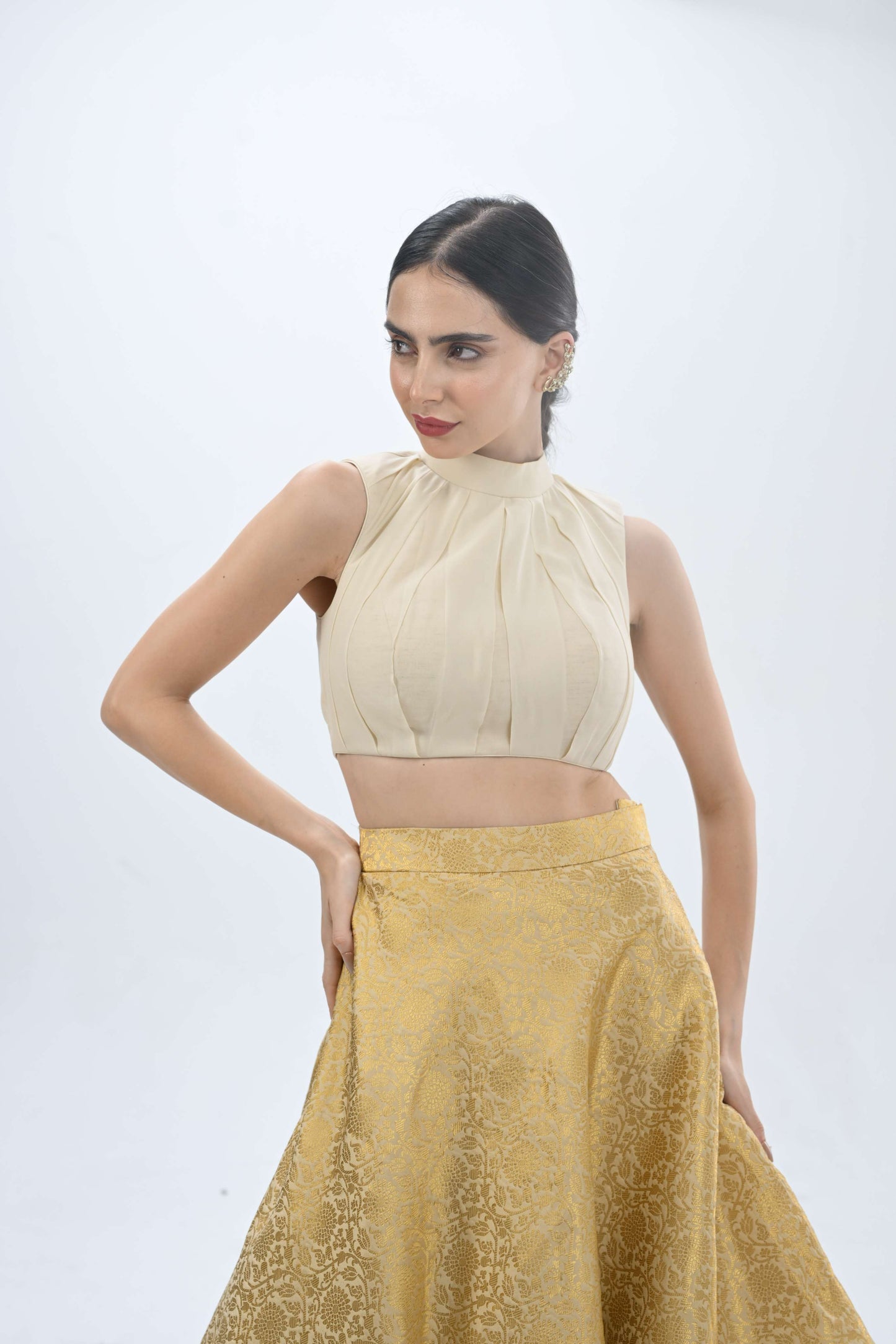 Halter neck Ersa off-white and gold lehenga by LabelN