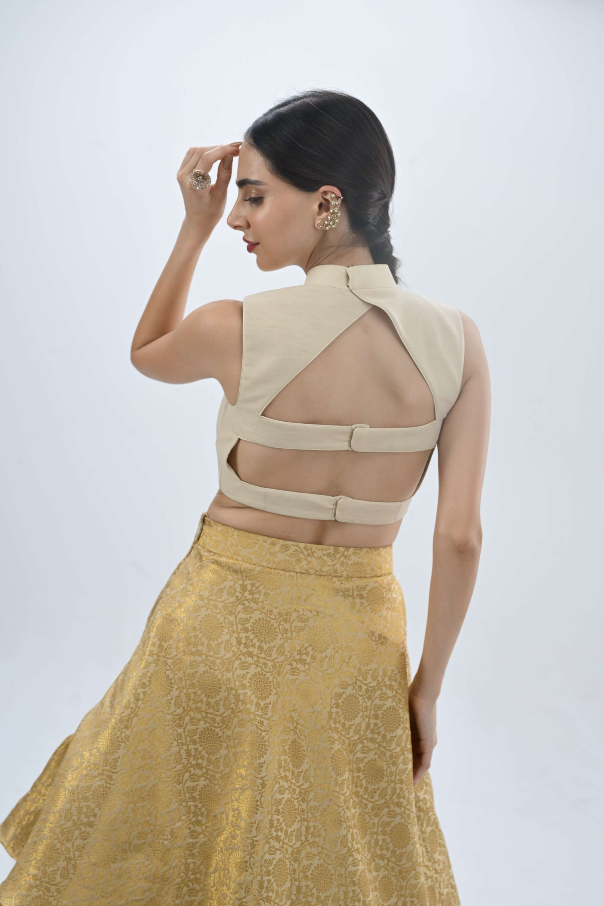 Halter neck Ersa off-white and gold lehenga by LabelN