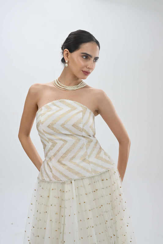 Off shoulder bustier princess lehenga in off-white by Label N